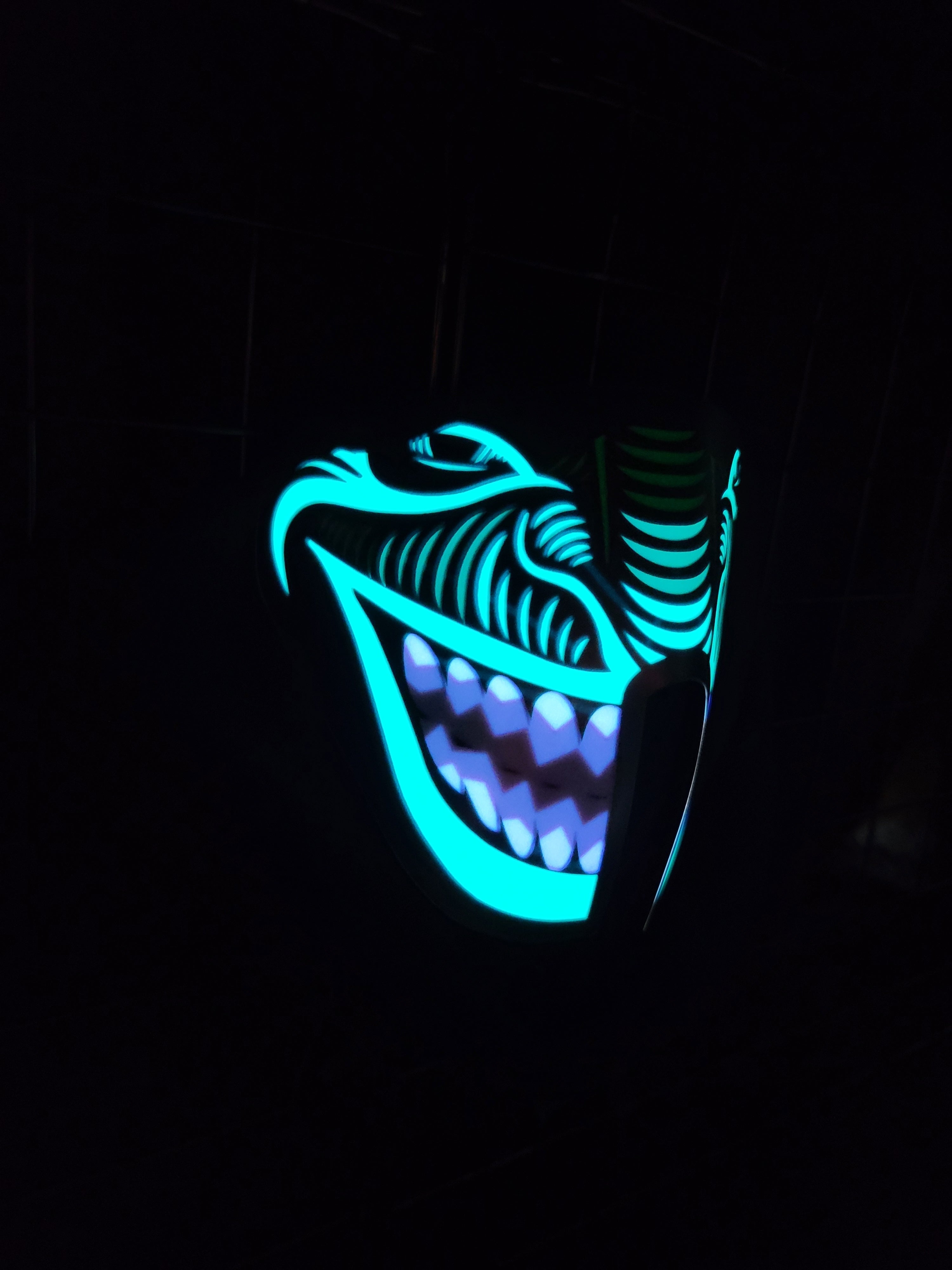 Sound activated green and purple smile mask