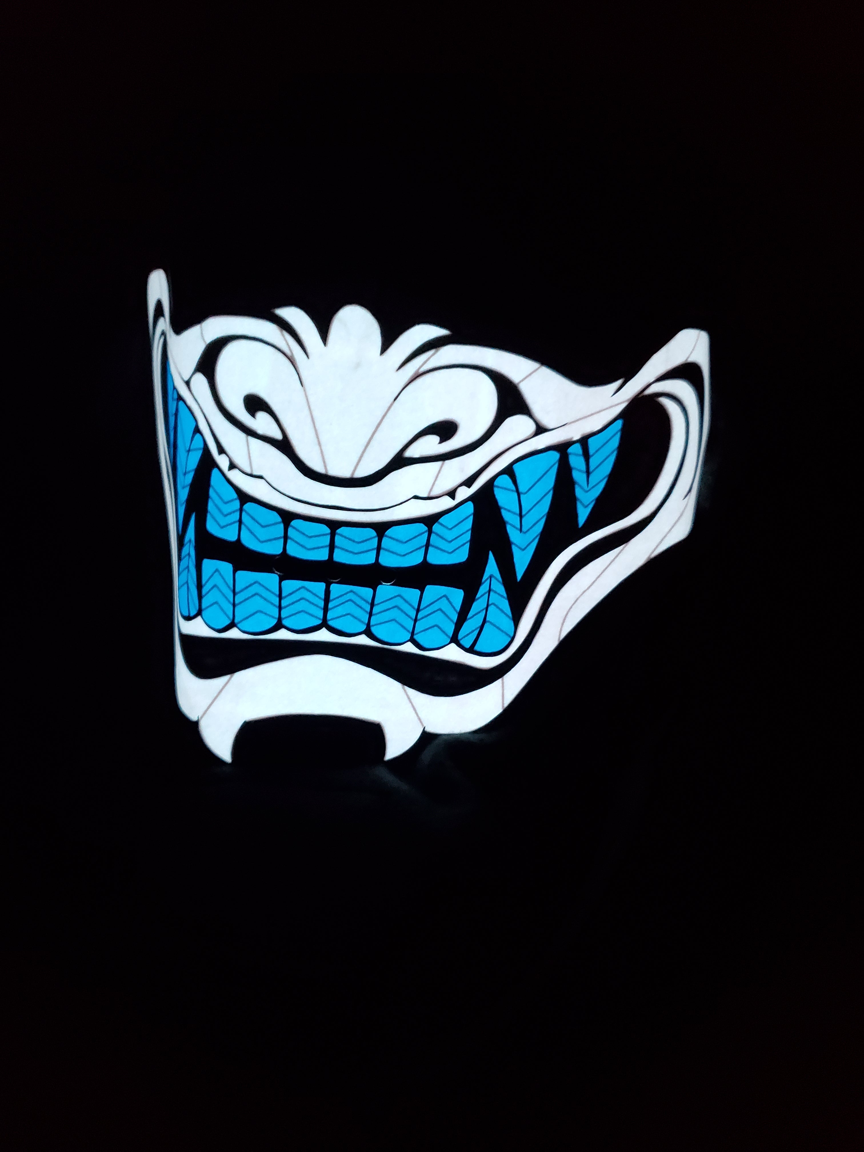 Sound activated white with blue oni mask